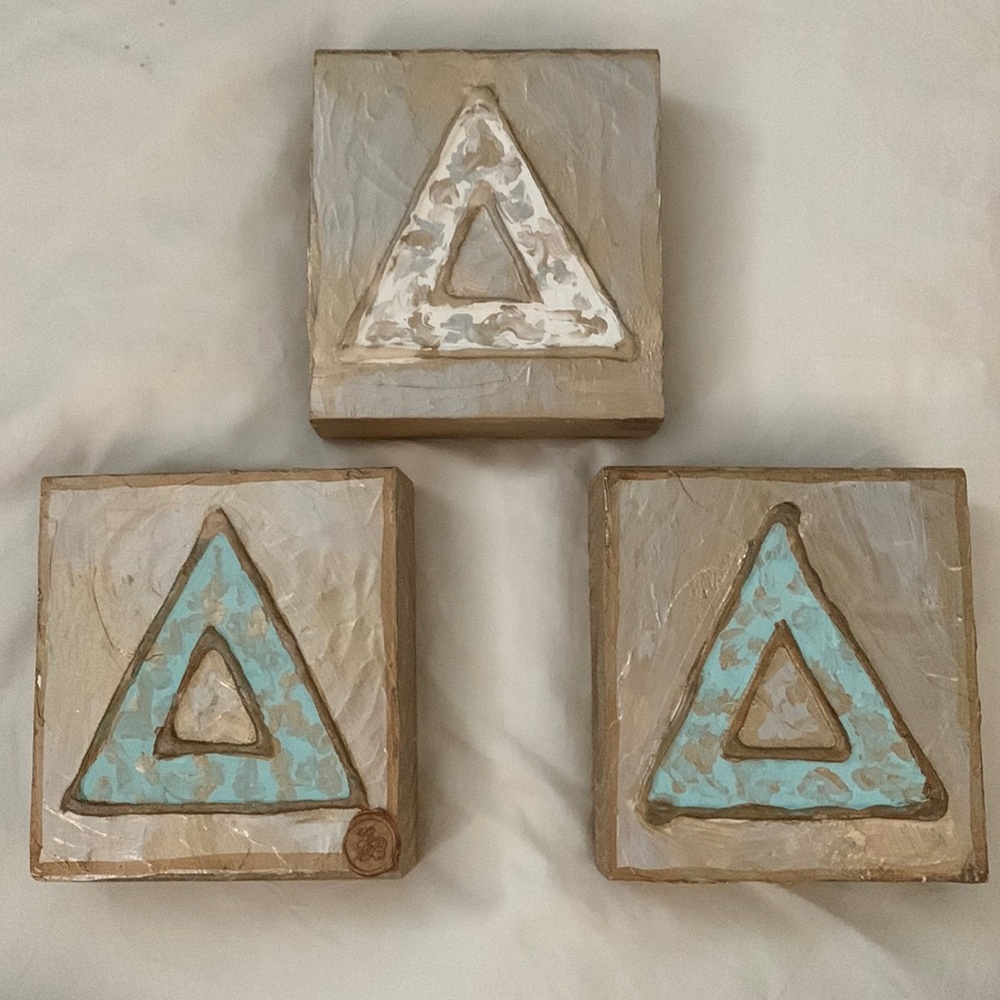 3 wooden triangle decor. 2 blue and 1 white